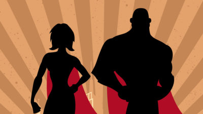 Silhouette of 2 superheros standing with capes